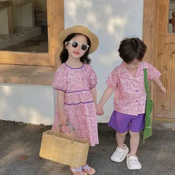 Baru Fashion Saudara Sisiter Kostum Musim Panas Anak Laki-laki Anak-anak Bunga Kemeja Lengan Pendek + Celana Pendek Solid 2 Buah Gaun Putri Katun Anak Perempuan